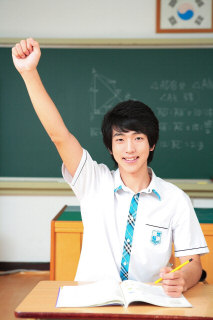 Student raising his hand in class