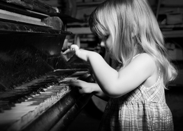 little girl playing piano