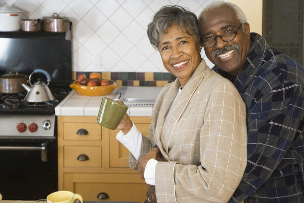 elderly couple happy loving hugging