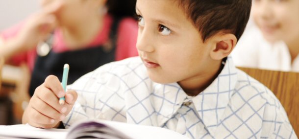 Young Student intently taking notes