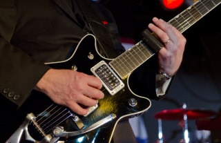 Musician Playing The Guitar