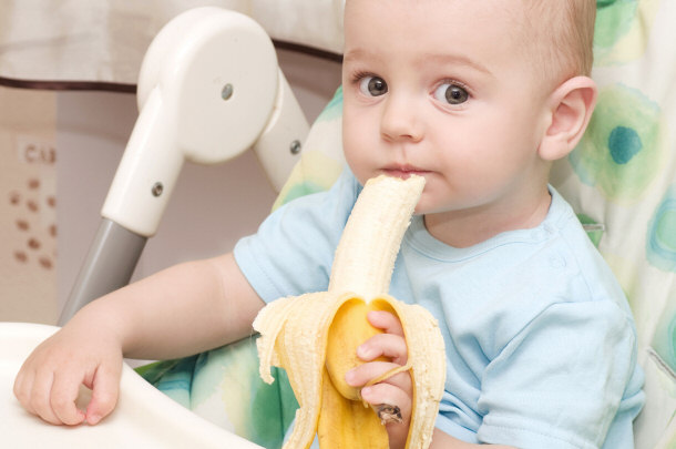 Baby eating a banana