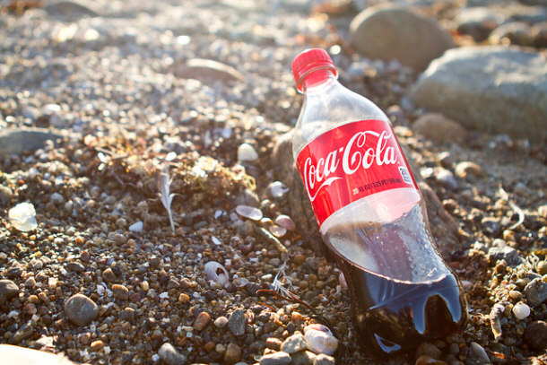 coca cola bottle on the beach