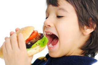 Kid eating fast food