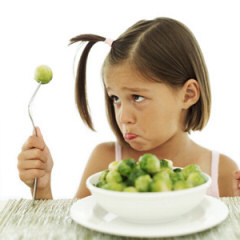 Kid eating Brussels Sprouts