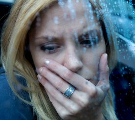 Woman crying in the rain