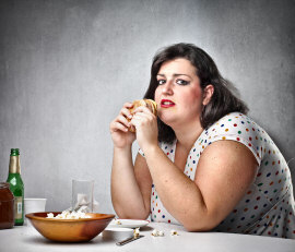 Overweight woman bad eating habits
