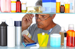 Man looking at medicines