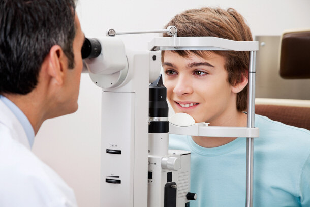 Optometrist Measuring Peripheral Vision With Visual Field Test