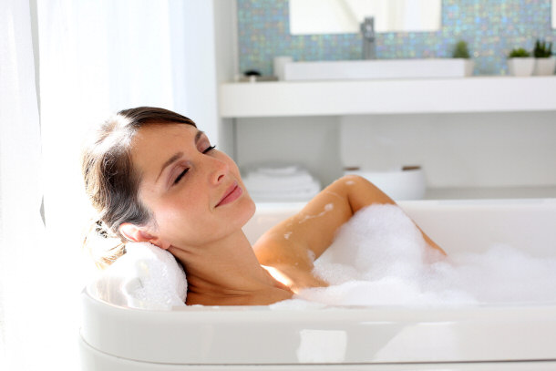 woman relaxing in bath bubble bath destress