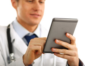 doctor using tablet technology