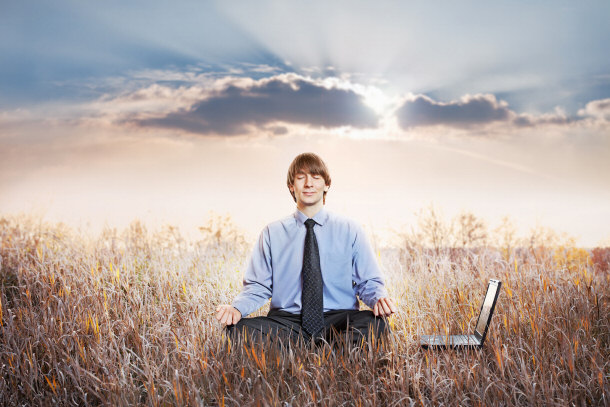 businessman meditating lotus pose