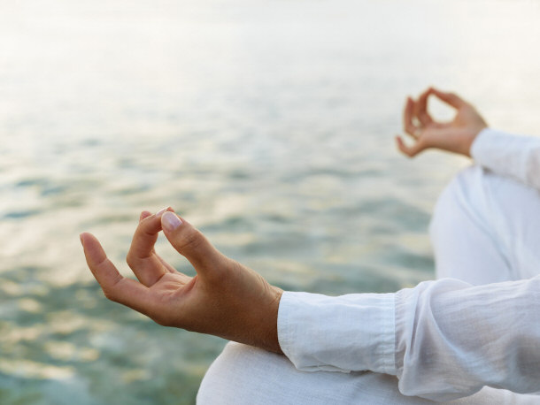Woman meditating to reduce stress