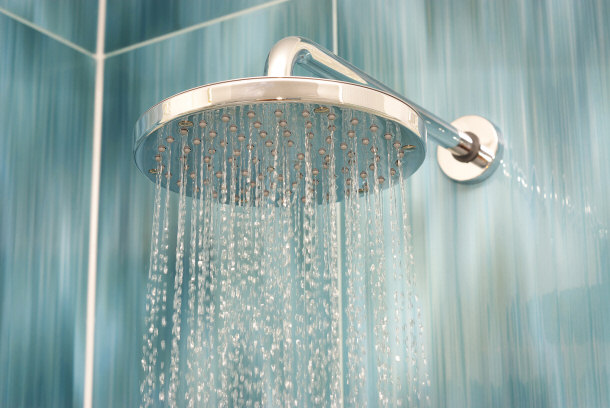 metal shower head with running water