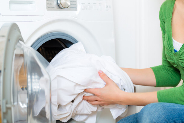 housekeeper washing clothes