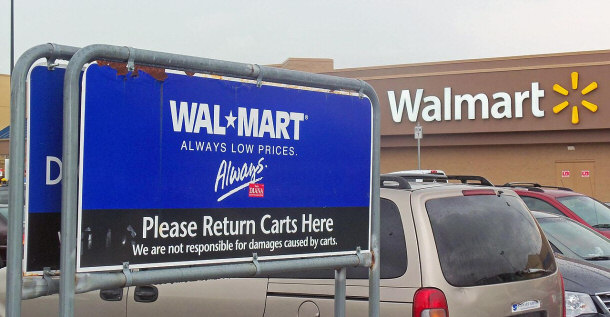 Old Logo on Cart Rack and New Logo on Store Exterior