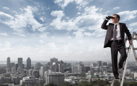 Businessman with binoculars