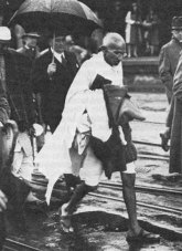 gandhi walking in london rain