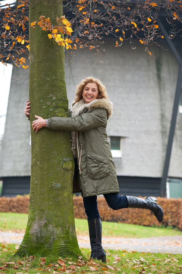 Woman loving a tree