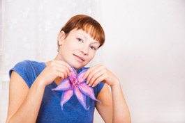 Attach a floral flower to a shirt collar