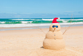 Snowman made of sand at the beach