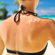 SPF 30 on woman's back
