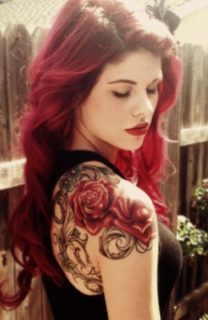 Sexy Red Head Girl with a Rose Tattoo on Shoulder