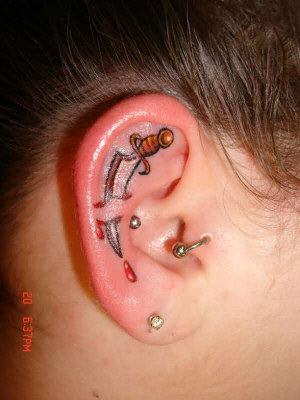 Sword Tattoo in ear