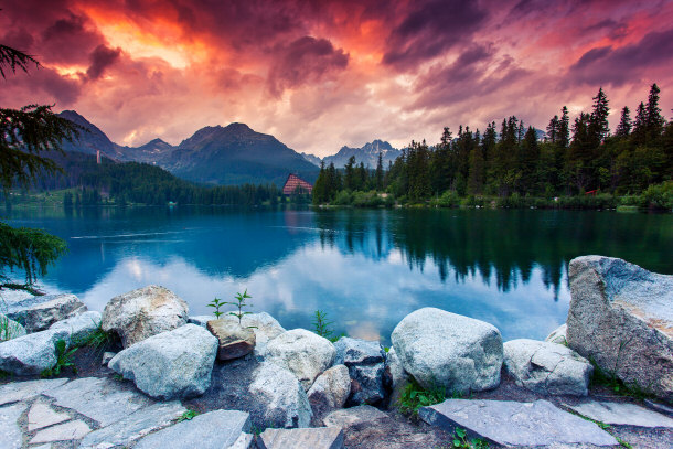 Mountain lake in National Park High Tatra. Dramatic overcrast sky. Strbske pleso, Slovakia, Europe.