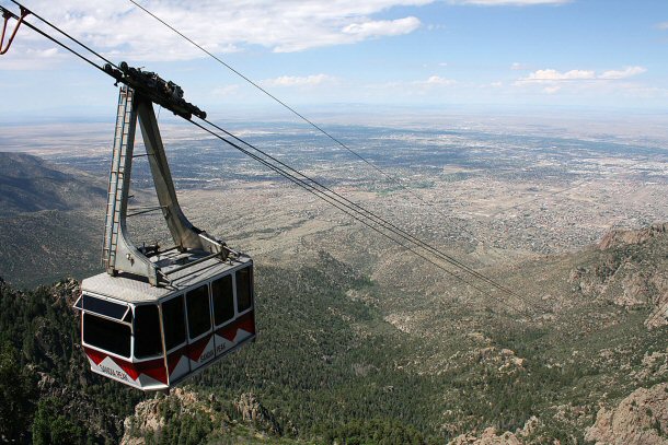 The Sandia Peak Tramway is a Swiss built cable car system that lifts visitors from the city up to the top of the Sandia Mountains, a rise in elevation of about 4,000 feet.