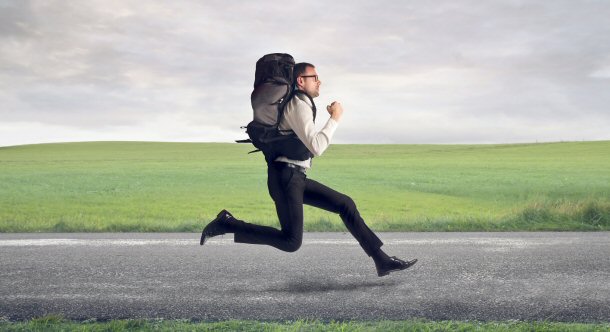 businessman running with backpack