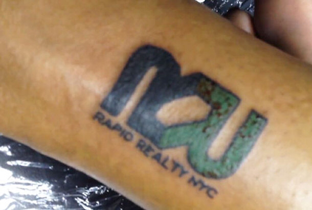 Tattooed Logo for Rapid Reality Where Employee Got 15% Payraise