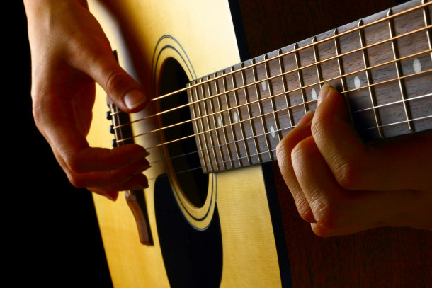 guitar player playing closeup