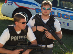 Two heavily armed policemen