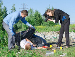 two forensic scientists working on a crime scene