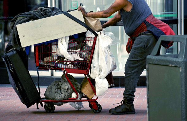 homeless man with shopping cart