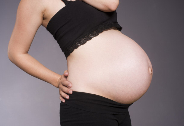 pregnant woman standing belly