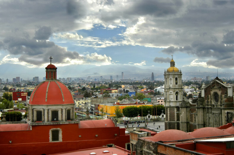 View of Mexico City Skyline Contrasting Modern and Old Structures